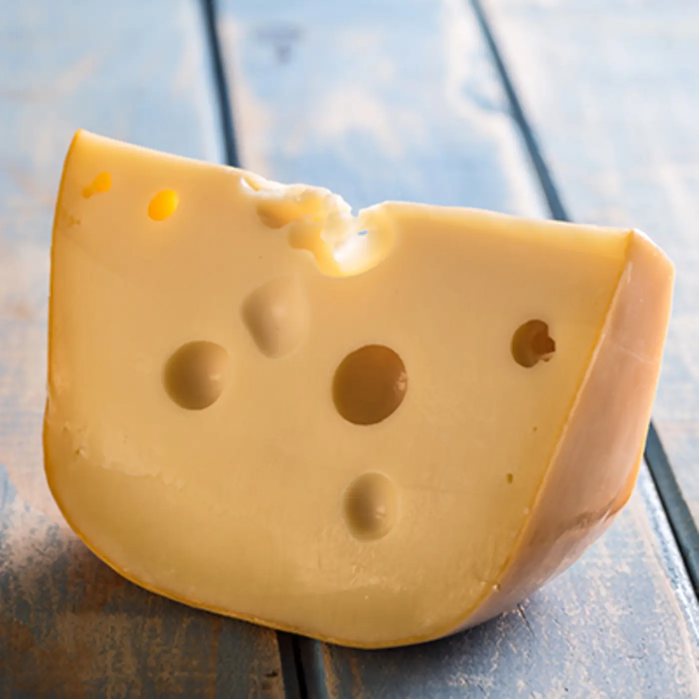 why does swiss cheese have holes