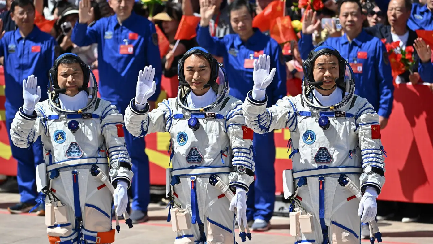 chinese astronauts stranded in space after debris hits their return capsule