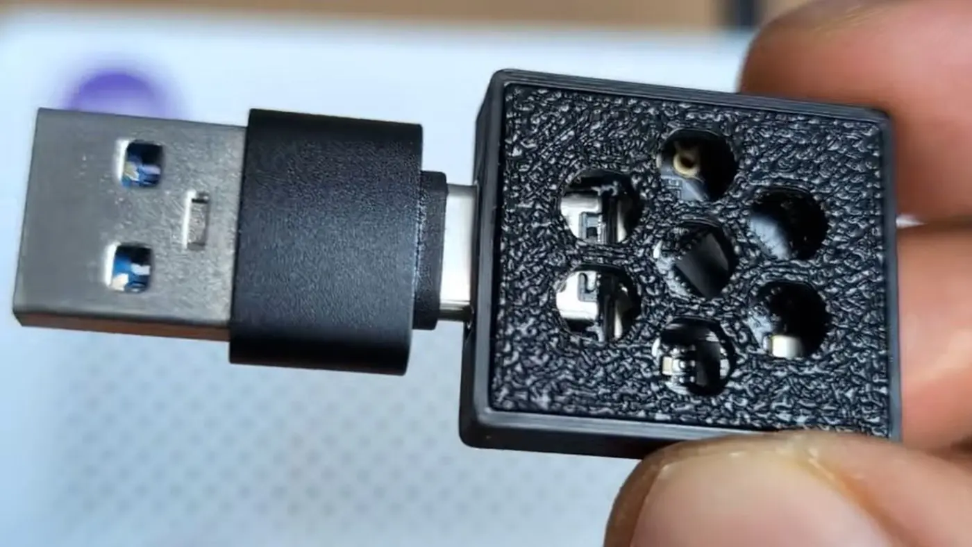 clever hacker fits 537000 domains in a 5 esp32 adblocking dongle