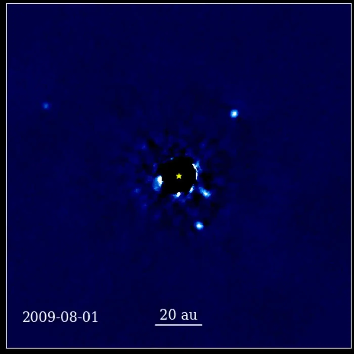 a 12year sequence of telescope images of a star and four planets orbiting