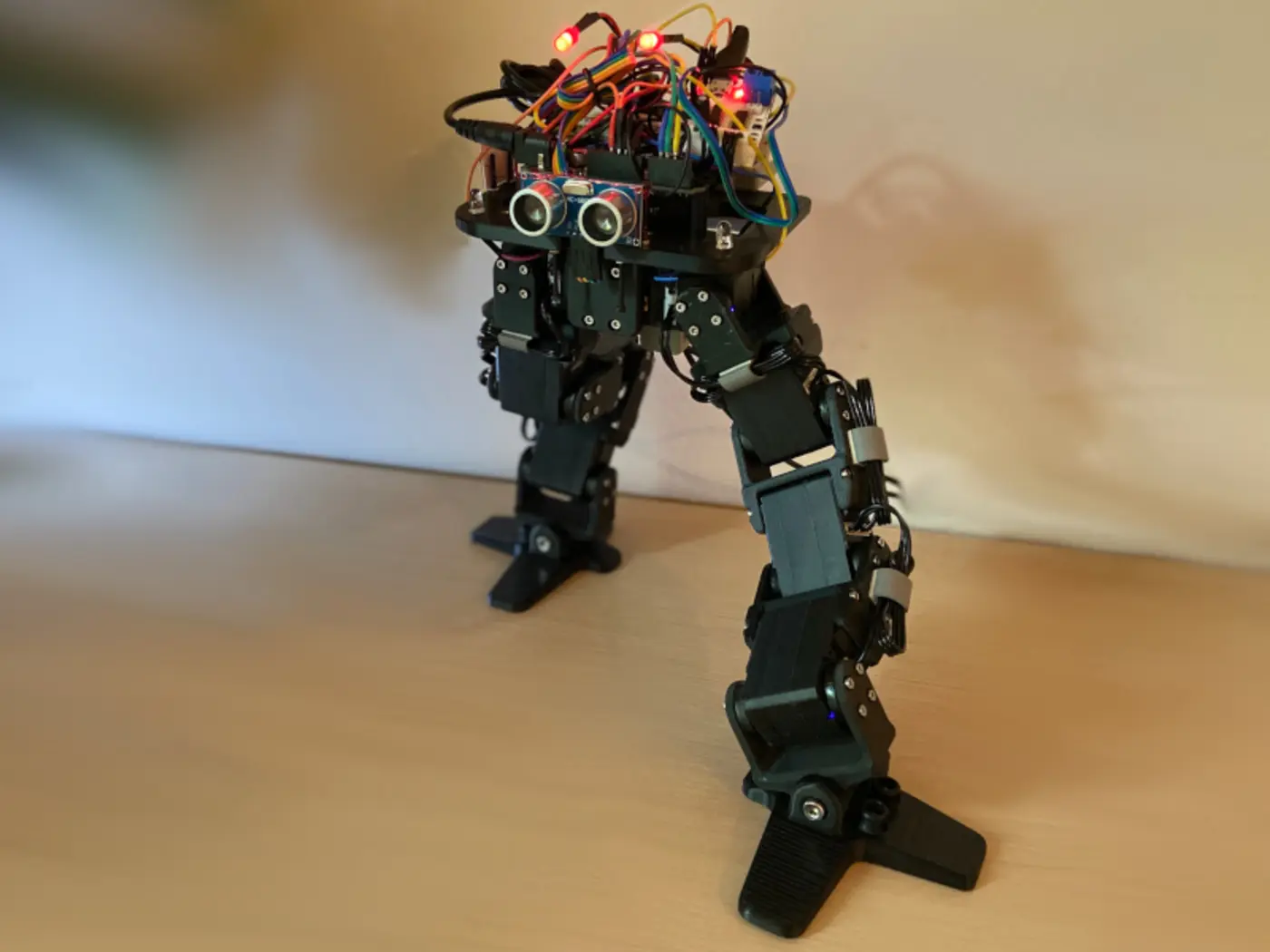 show hn 3dprinted bipedal robot with 8servo limit to teach robotics