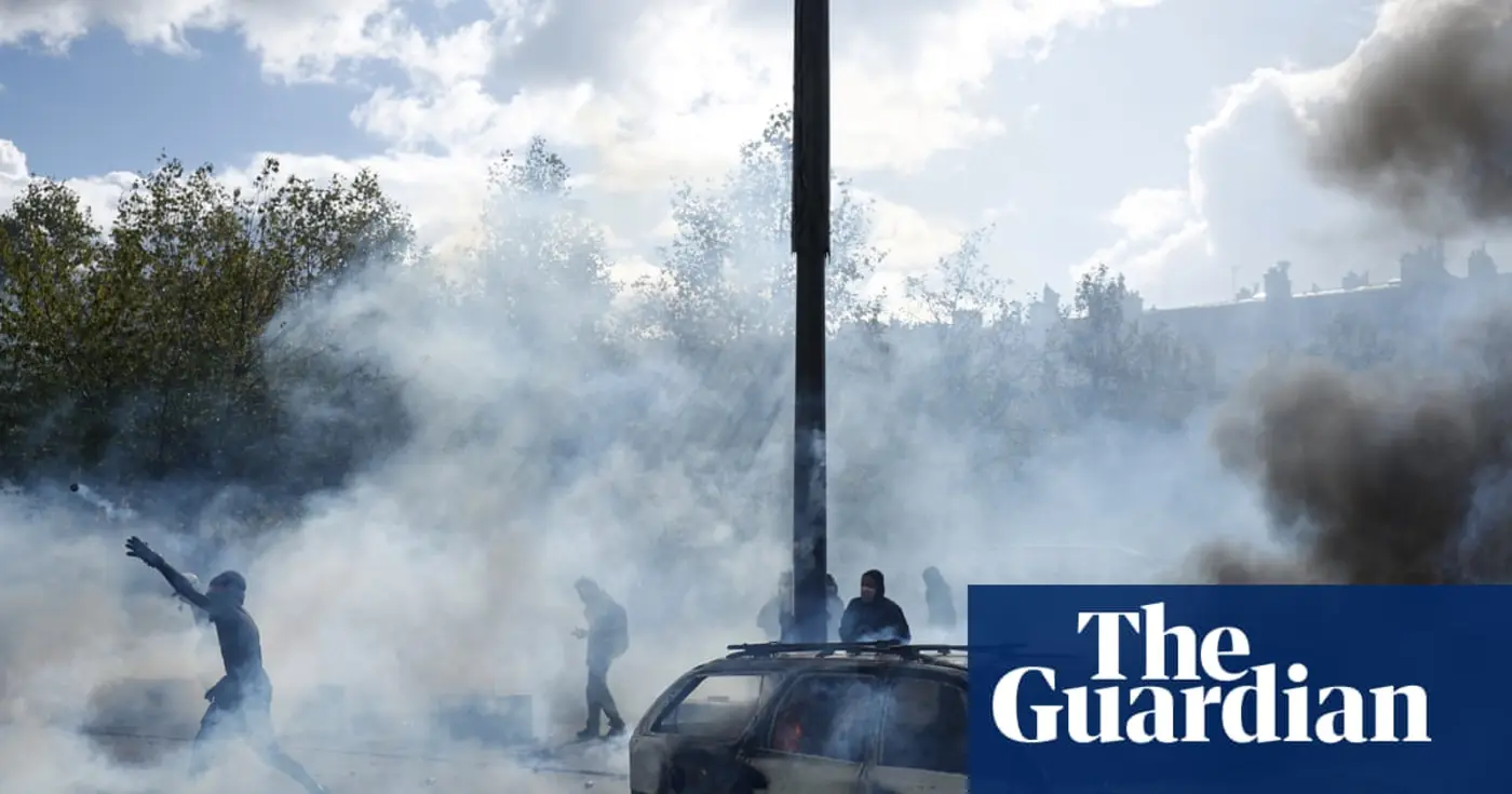 buildings set ablaze as police clash with protesters across france